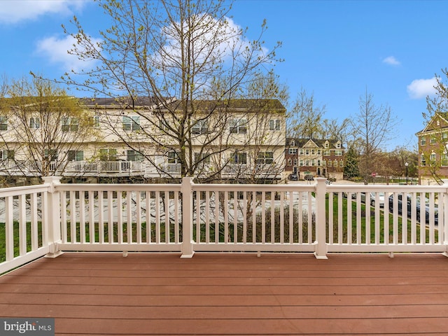 wooden terrace featuring a residential view