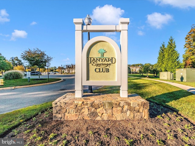 community sign with a lawn