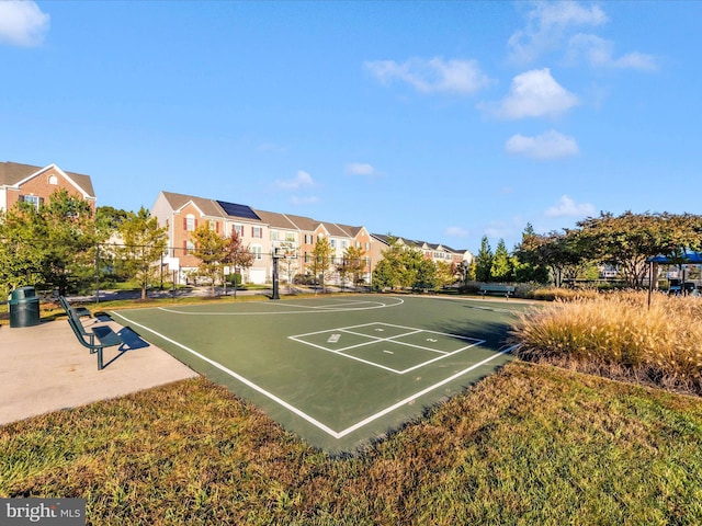 surrounding community with community basketball court, a residential view, and fence