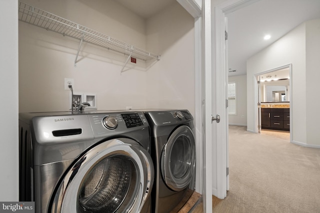 washroom featuring washer and clothes dryer, light colored carpet, baseboards, and recessed lighting