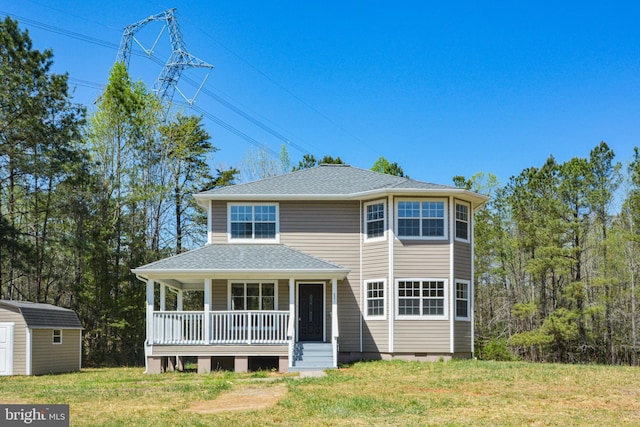 5371 Cedon Rd, Woodford, VA 22580 - view of front of house featuring a storage shed, covered porch, an outdoor structure, a front yard, and a shingled roof