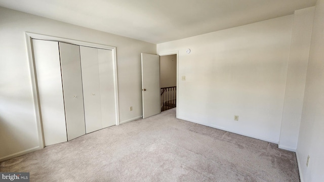 2028 6th St S, Arlington, VA 22204 - unfurnished bedroom with light carpet, a closet, and baseboards