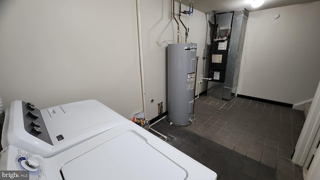 2028 6th St S, Arlington, VA 22204 - clothes washing area with electric water heater, washer and clothes dryer, and dark tile patterned floors
