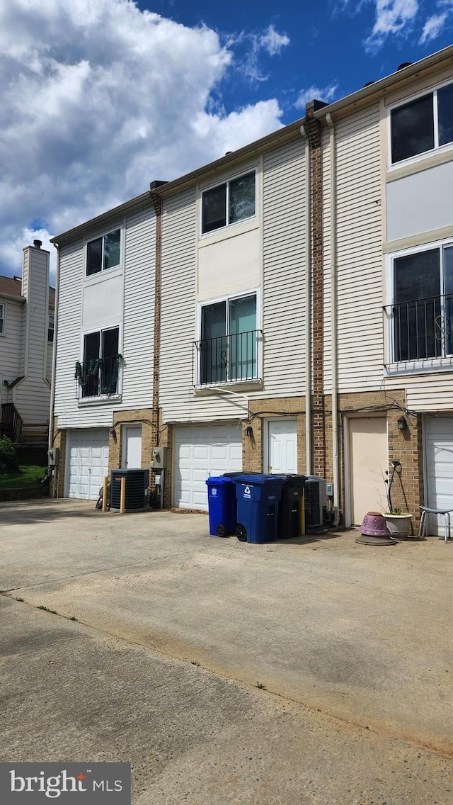 2028 6th St S, Arlington, VA 22204 - view of building exterior featuring central AC and a garage