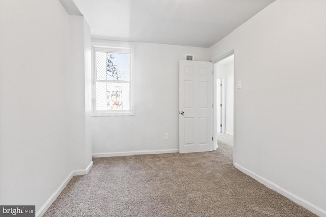 unfurnished bedroom with baseboards and carpet floors