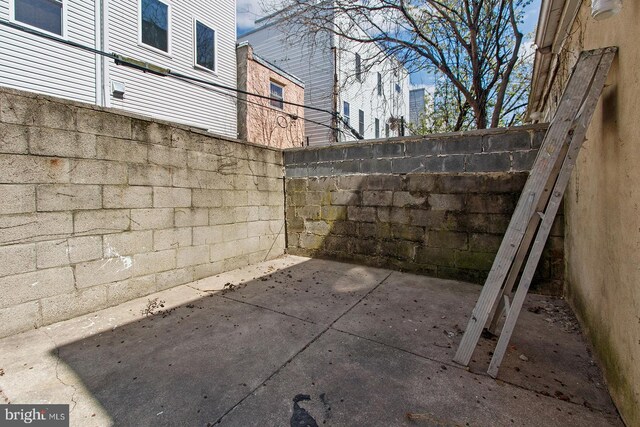 exterior space with fence and a patio