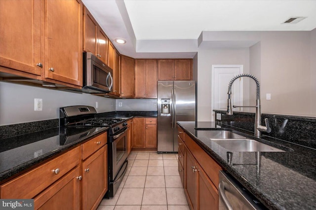 1806 Monocacy View Cir Unit 41A, Frederick, MD 21701 - kitchen featuring a sink, visible vents, brown cabinetry, and appliances with stainless steel finishes