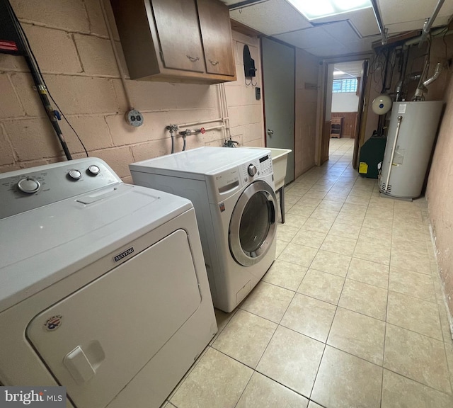 2226 Glenview St, Philadelphia, PA 19149 - clothes washing area featuring light tile patterned floors, washing machine and dryer, gas water heater, and cabinet space