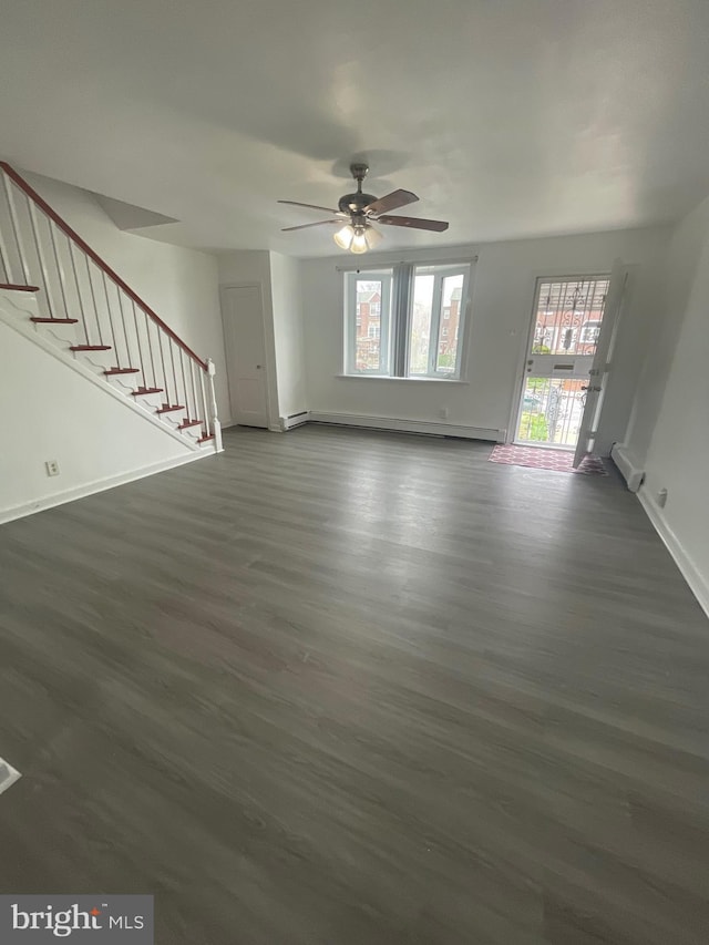 2226 Glenview St, Philadelphia, PA 19149 - unfurnished living room featuring baseboards, ceiling fan, baseboard heating, dark wood finished floors, and stairway