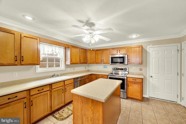 kitchen with light tile patterned flooring, stainless steel appliances, light countertops, and a sink