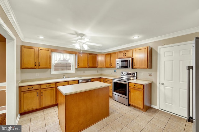 kitchen featuring light tile patterned floors, ornamental molding, stainless steel appliances, and light countertops