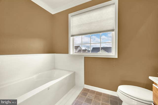 full bathroom with toilet, vanity, crown molding, baseboards, and a garden tub