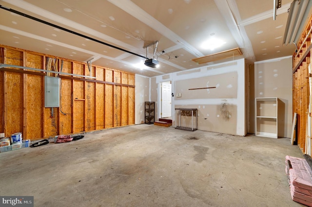 garage featuring electric panel and a garage door opener