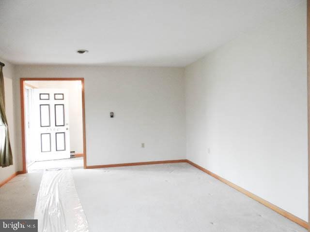 2560 Sardonyx Dr, Chambersburg, PA 17202 - spare room featuring baseboards and light colored carpet