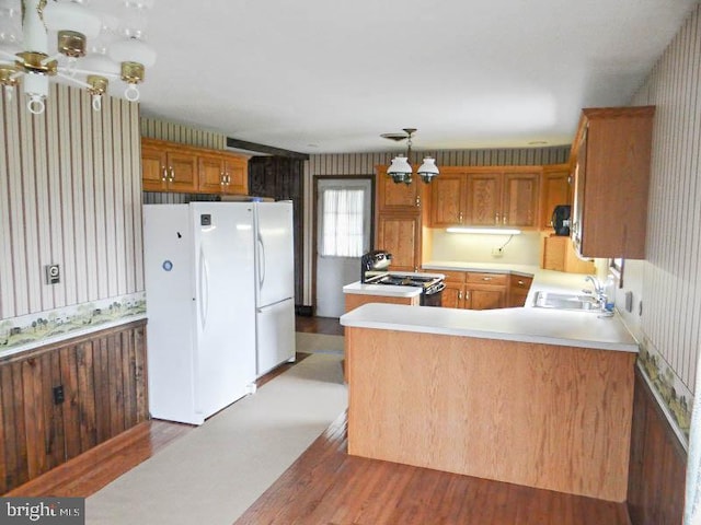 2560 Sardonyx Dr, Chambersburg, PA 17202 - kitchen featuring a sink, light countertops, freestanding refrigerator, brown cabinetry, and gas stove