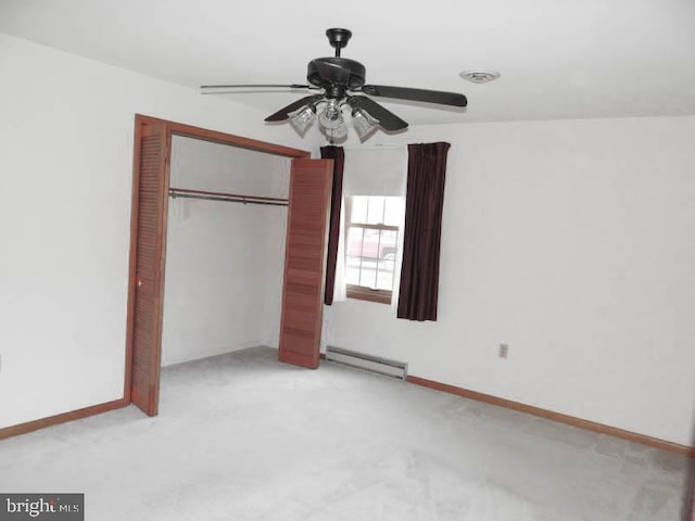 2560 Sardonyx Dr, Chambersburg, PA 17202 - unfurnished bedroom featuring a closet, baseboards, a baseboard radiator, a ceiling fan, and light carpet