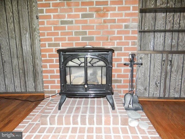 2560 Sardonyx Dr, Chambersburg, PA 17202 - interior details featuring a wood stove and wood finished floors