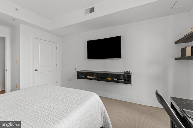 bedroom with carpet and baseboards