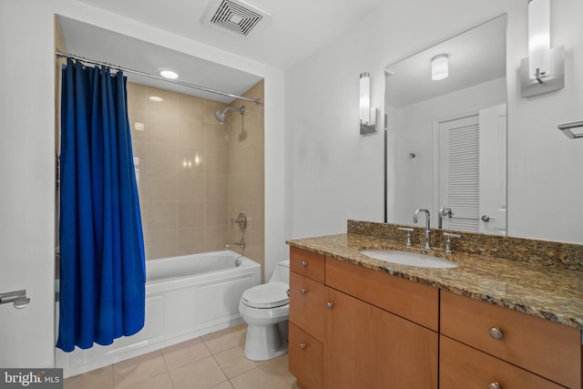 bathroom featuring tile patterned flooring, toilet, shower / bath combination with curtain, and vanity