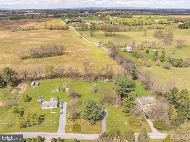 birds eye view of property with a rural view