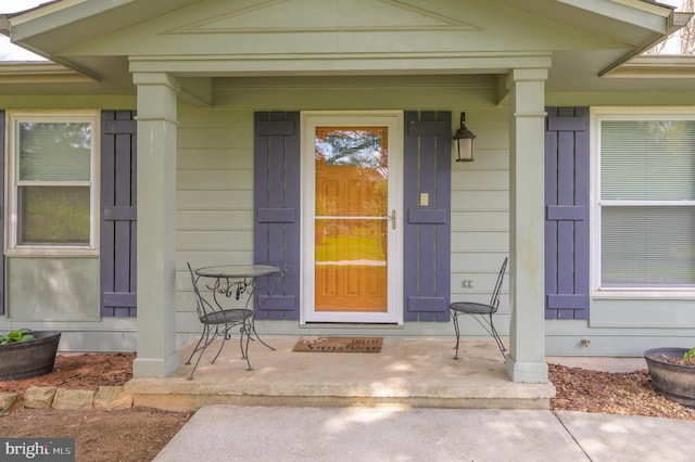 doorway to property featuring a porch