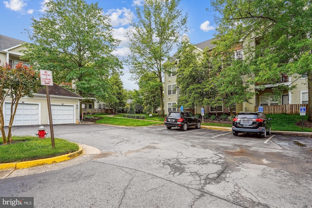 4129 Fountainside Ln Unit 202, Fairfax, VA 22030 - view of asphalt street with curbs and traffic signs