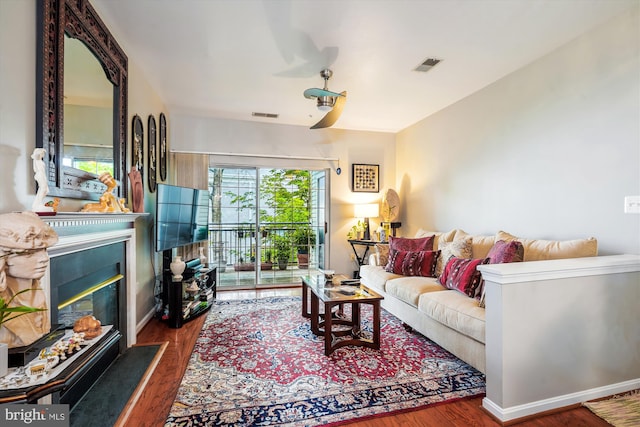 4129 Fountainside Ln Unit 202, Fairfax, VA 22030 - living area with wood finished floors and a glass covered fireplace