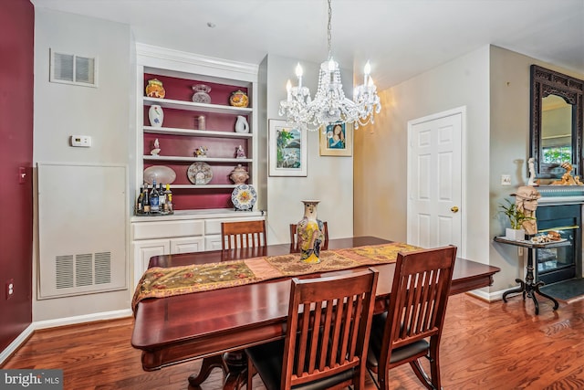 4129 Fountainside Ln Unit 202, Fairfax, VA 22030 - dining area featuring wood finished floors, a chandelier, and baseboards