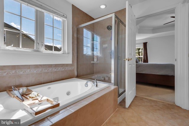 bathroom with a shower stall, tile patterned floors, a jetted tub, and connected bathroom