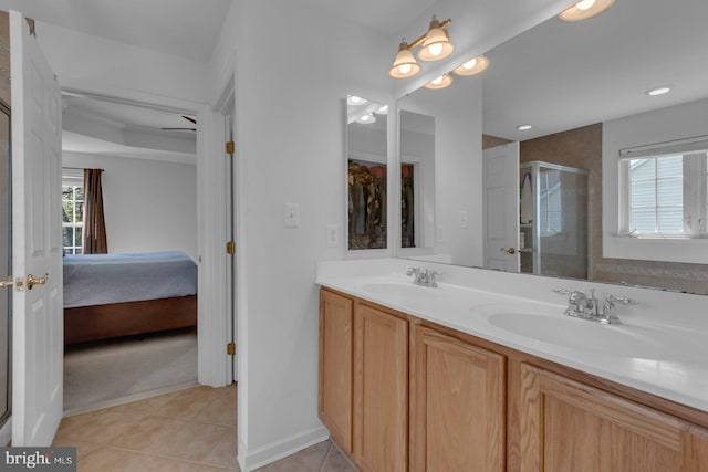 full bath featuring a wealth of natural light, a sink, and a shower stall