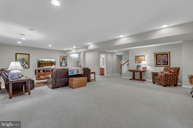 living area featuring recessed lighting, baseboards, stairs, and light carpet
