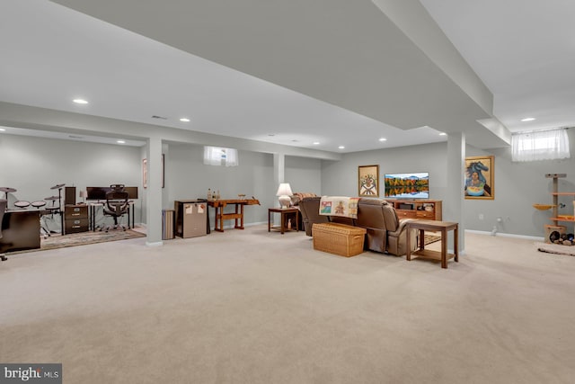 living area featuring baseboards, light carpet, and recessed lighting