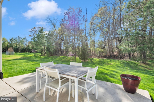 view of patio featuring outdoor dining area