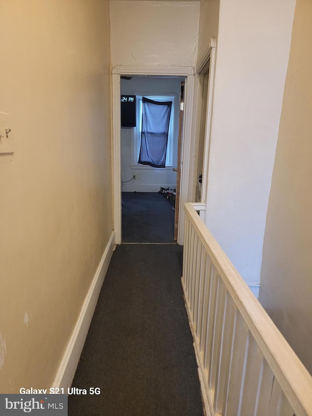 2538 N Myrtlewood St, Philadelphia, PA 19132 - corridor featuring baseboards and dark colored carpet