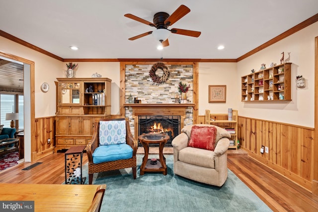 135 Cleremont Dr, Fredericksburg, VA 22405 - living area featuring wood finished floors, ornamental molding, a ceiling fan, and a wainscoted wall