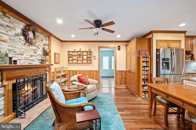 135 Cleremont Dr, Fredericksburg, VA 22405 - living room with ornamental molding, ceiling fan, light wood-type flooring, a fireplace, and wainscoting