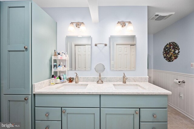 135 Cleremont Dr, Fredericksburg, VA 22405 - bathroom with double vanity, a sink, visible vents, and a wainscoted wall