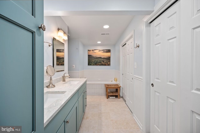 135 Cleremont Dr, Fredericksburg, VA 22405 - full bathroom with double vanity, recessed lighting, tile patterned flooring, a bath, and a sink