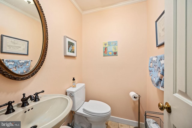 135 Cleremont Dr, Fredericksburg, VA 22405 - half bath with baseboards, ornamental molding, tile patterned floors, toilet, and a sink