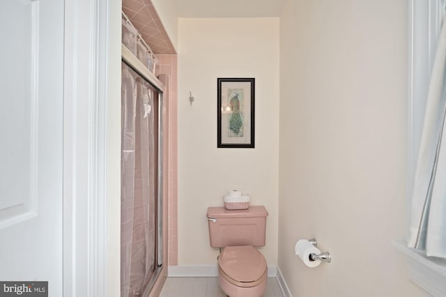 135 Cleremont Dr, Fredericksburg, VA 22405 - full bathroom with toilet, a stall shower, baseboards, and tile patterned floors