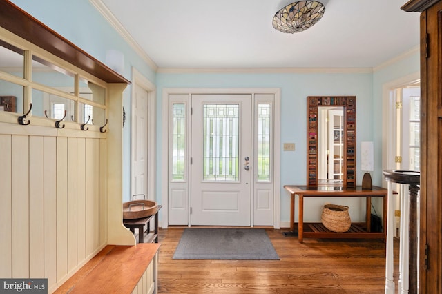 135 Cleremont Dr, Fredericksburg, VA 22405 - foyer with light wood finished floors, ornamental molding, and a healthy amount of sunlight