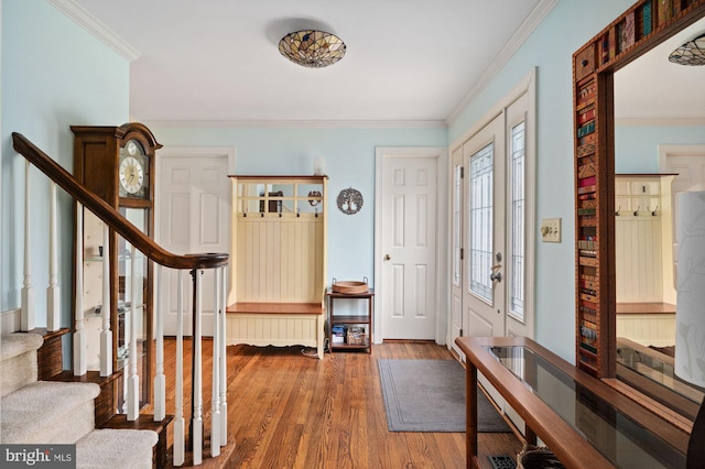 135 Cleremont Dr, Fredericksburg, VA 22405 - foyer entrance with wood finished floors, ornamental molding, and stairs