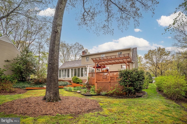 135 Cleremont Dr, Fredericksburg, VA 22405 - rear view of property with a pergola, a wooden deck, a sunroom, a lawn, and a chimney