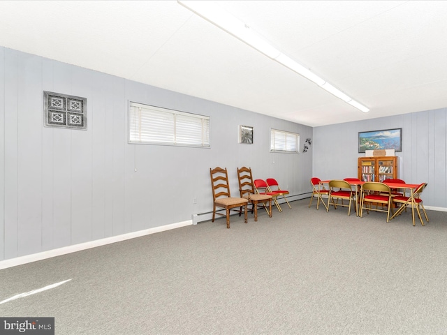 recreation room featuring baseboards and carpet floors