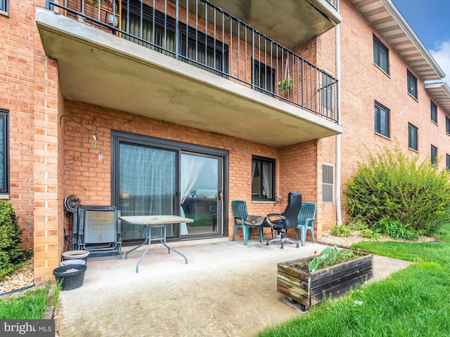 view of patio with a balcony