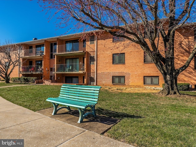 view of community featuring a yard
