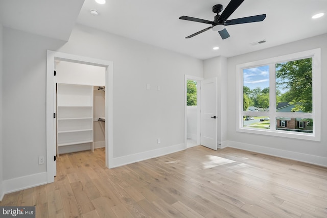 4134 Maple Ave, Fairfax, VA 22032 - unfurnished bedroom featuring recessed lighting, light wood-style flooring, baseboards, and a walk in closet