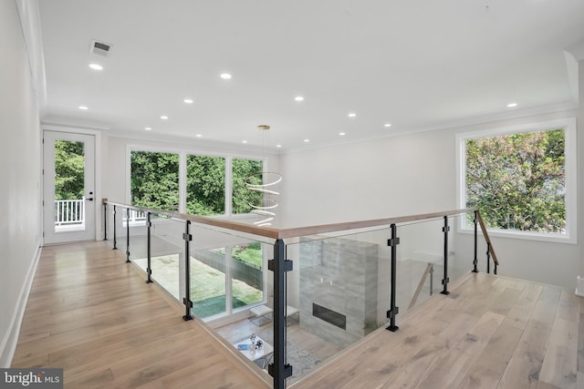 4134 Maple Ave, Fairfax, VA 22032 - corridor with light wood-style floors, crown molding, an upstairs landing, and visible vents