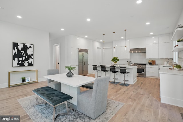 4134 Maple Ave, Fairfax, VA 22032 - dining space featuring light wood-style floors, recessed lighting, and baseboards