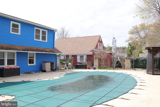view of swimming pool featuring a fenced in pool, central AC, a patio, and fence